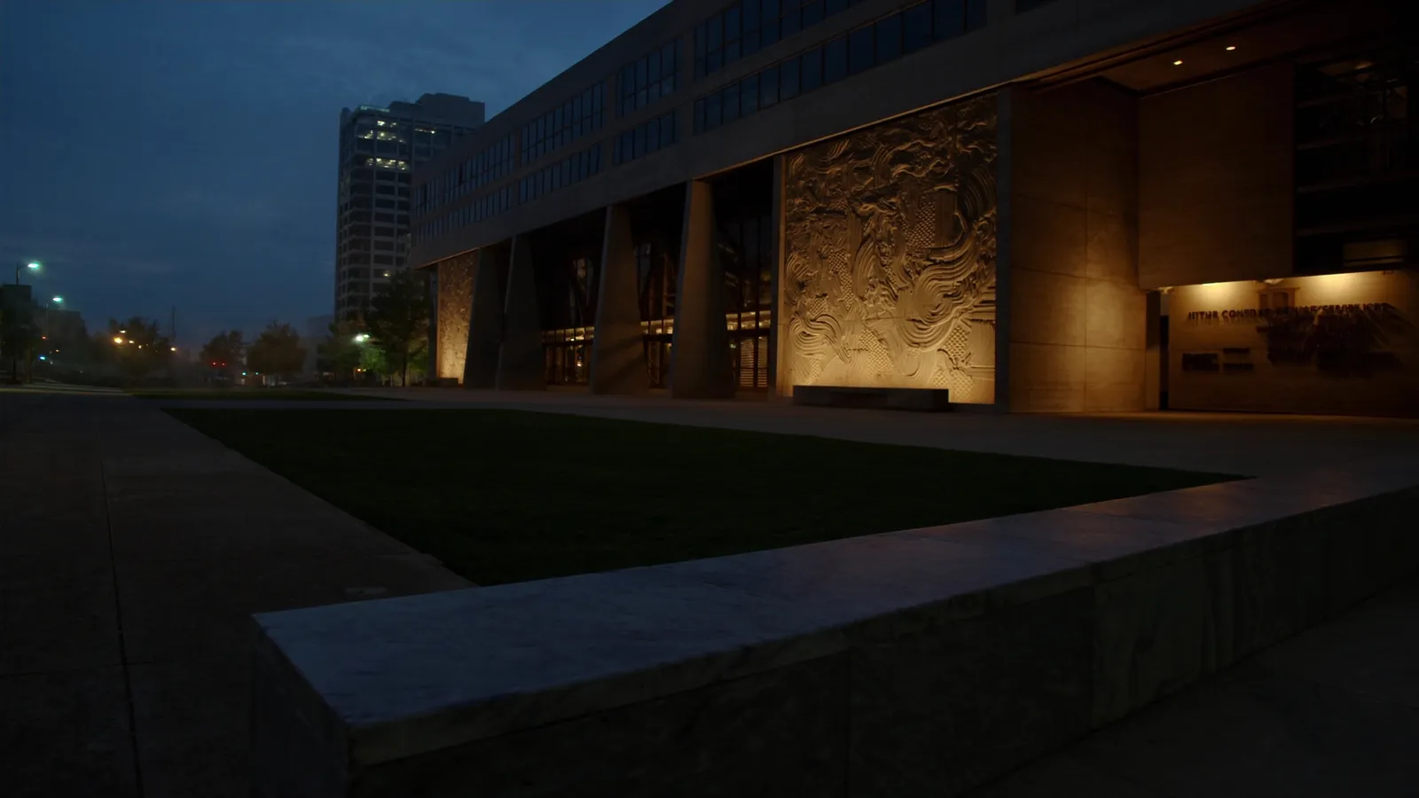 Modern architecture in the Dallas Arts District lit at blue hour