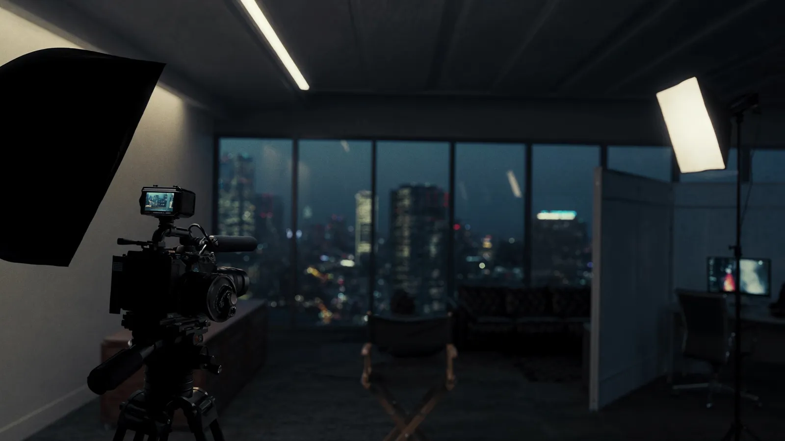Cinema camera and lighting setup for a corporate video shoot in a Dallas high-rise office