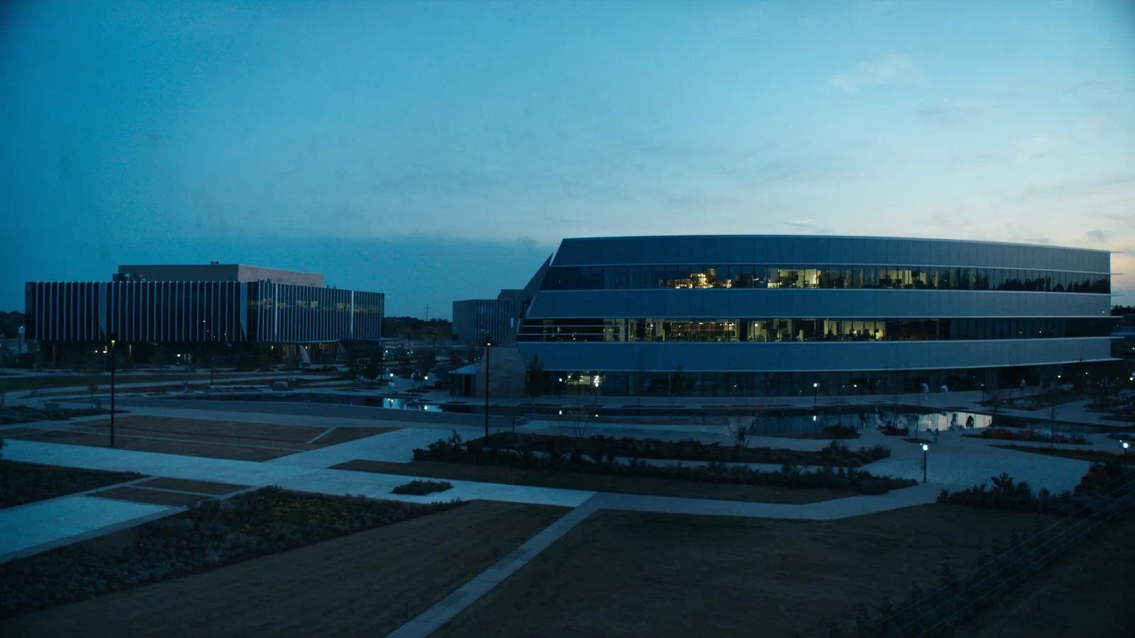 Modern corporate campus architecture in Frisco Texas at dusk
