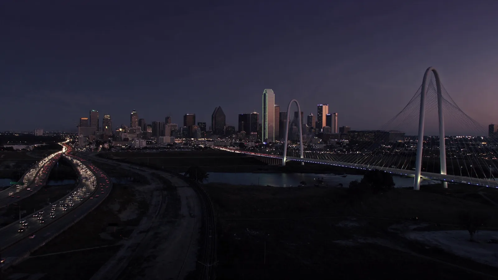 The Margaret Hunt Hill Bridge and Dallas skyline at twilight, a signature DFW filming backdrop