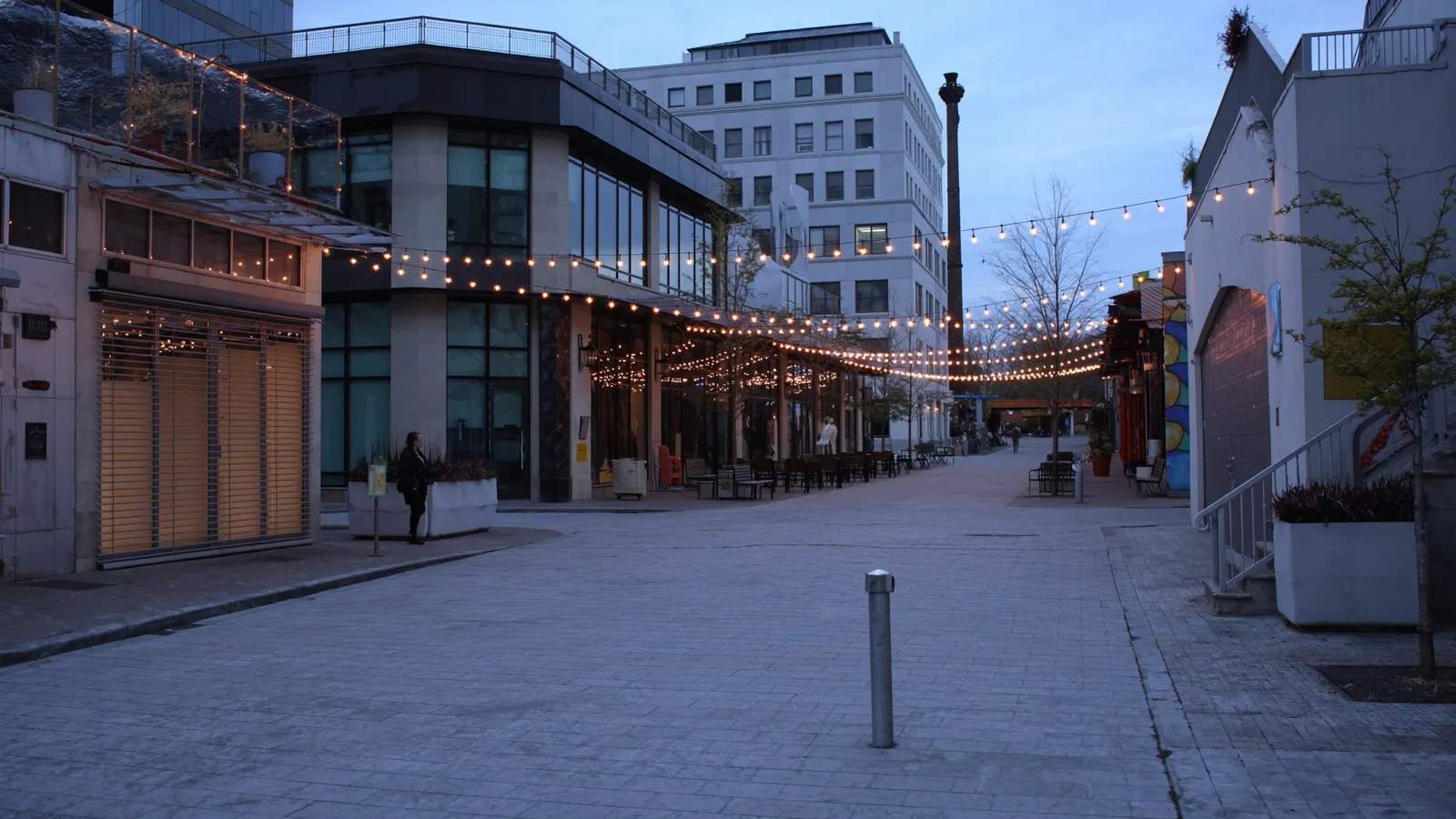 Upscale open-air mixed-use development in Plano Texas in the evening