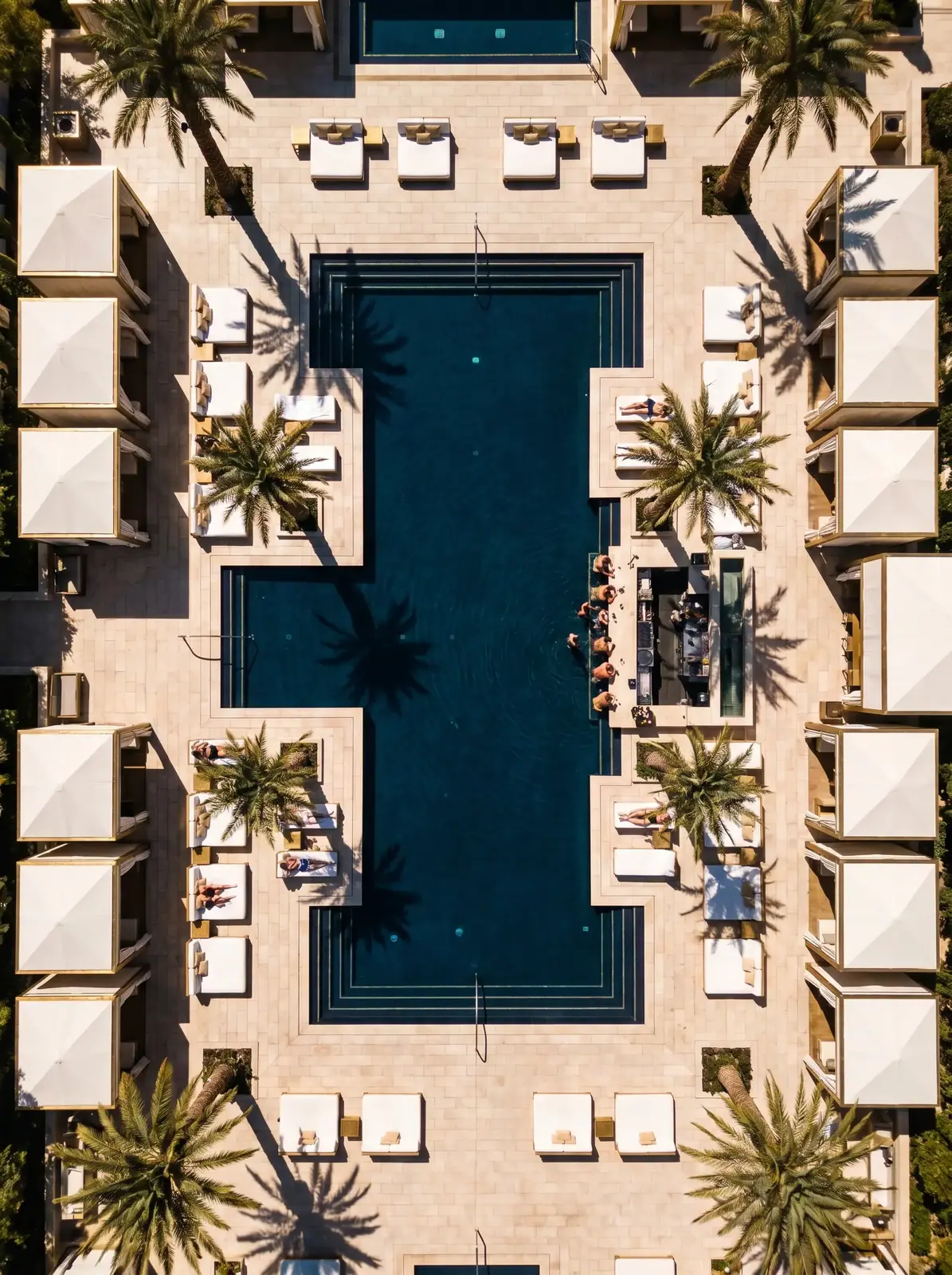 Aerial photograph of a beach club and pool complex