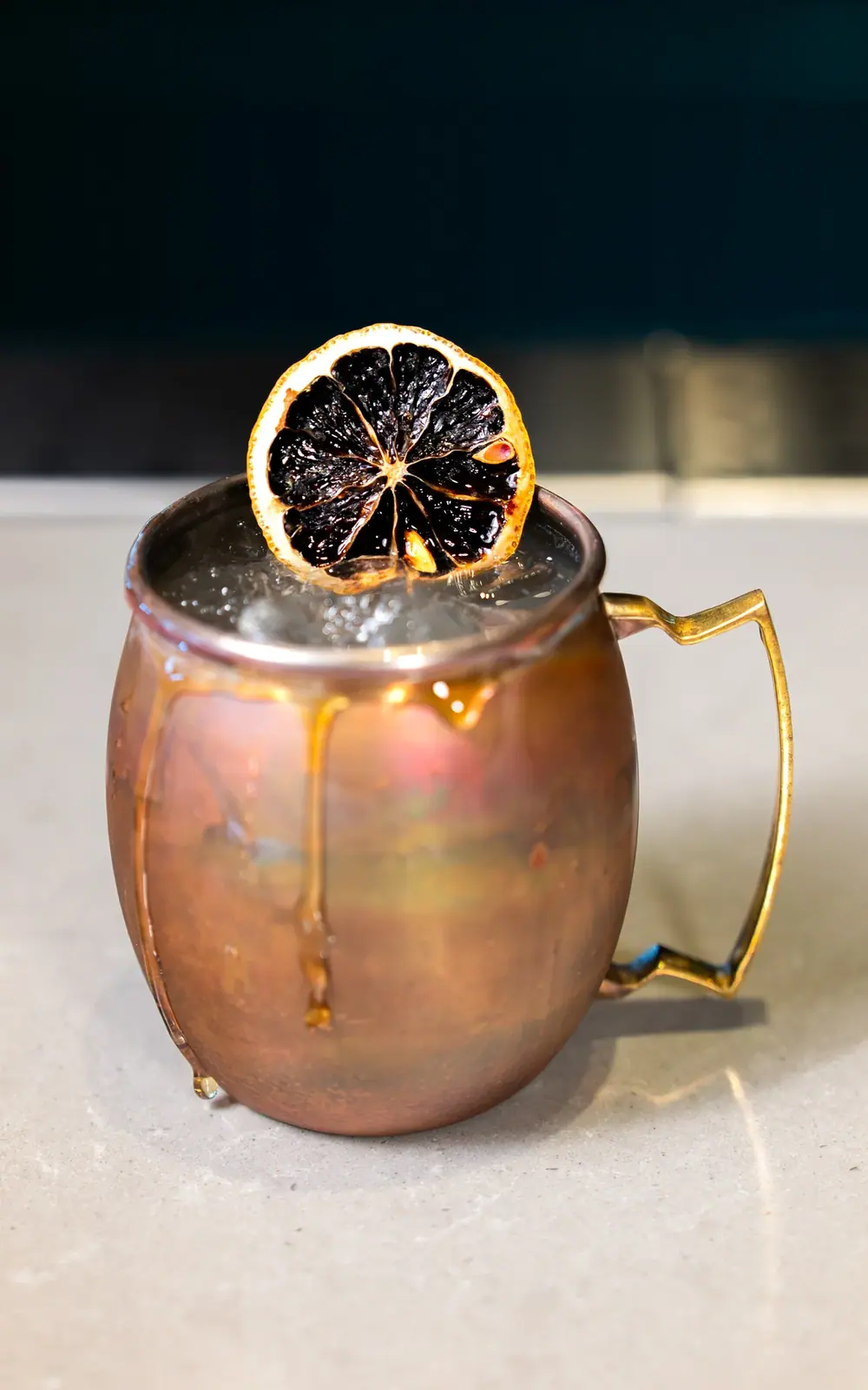 Copper mug cocktail photographed with condensation detail